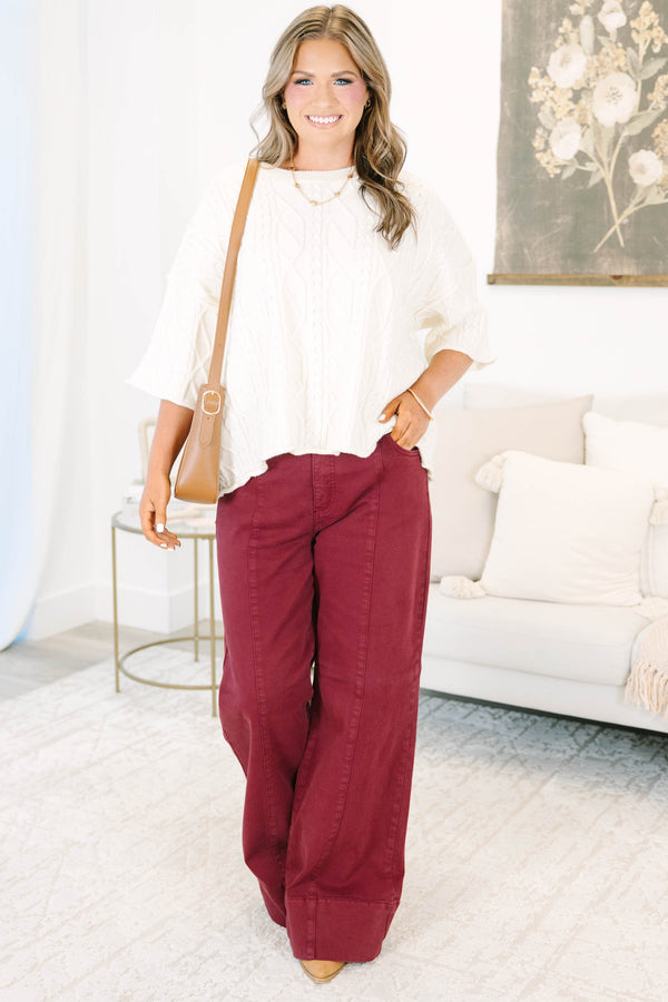 Plus size wine-colored wide leg pants in a stretchy cotton blend with a flattering high-waist fit.