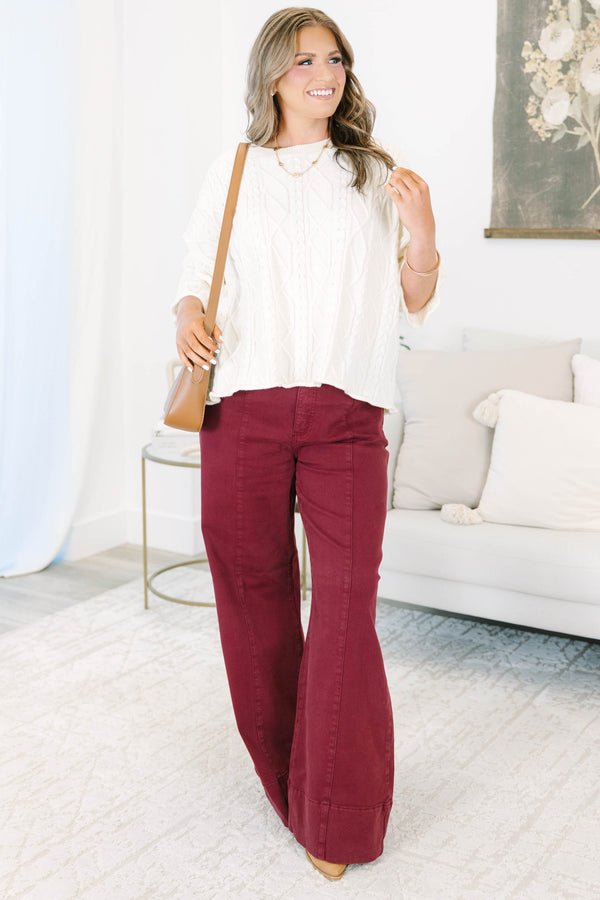 Plus size wine-colored wide leg pants in a stretchy cotton blend with a flattering high-waist fit.