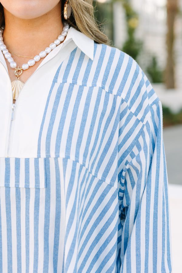 Chic Soul plus size clothing, blue striped top with a zipper detail on the chest outlined by solid white blocking around the neckline and the zipper.
