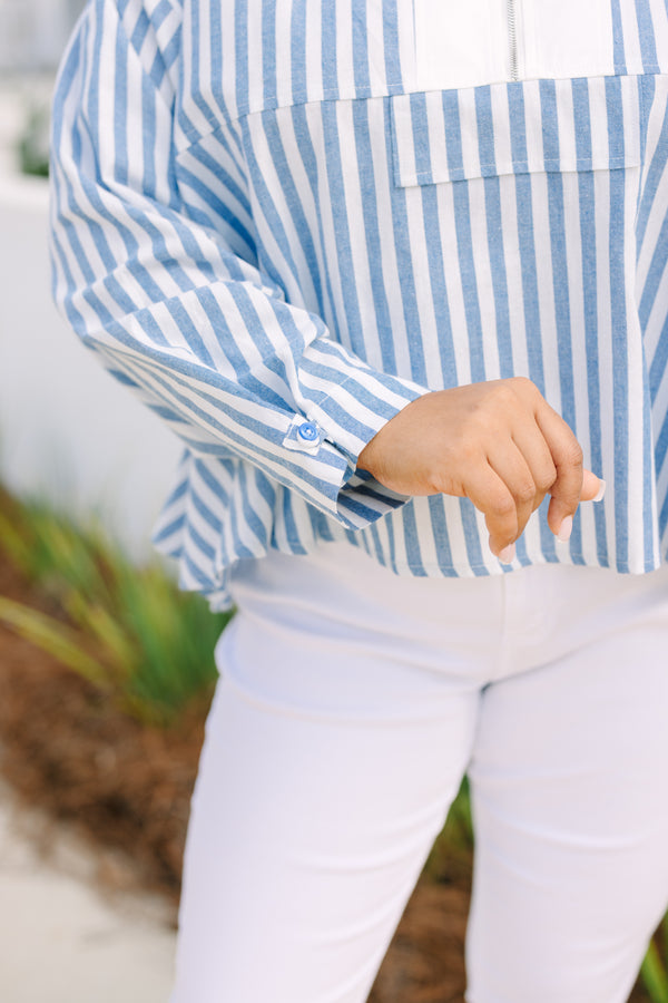 Chic Soul plus size clothing, blue striped top with a zipper detail on the chest outlined by solid white blocking around the neckline and the zipper.
