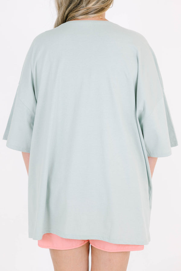 Plus Size light sage boyfriend tee with a buffalo graphic and pink athletic shorts.