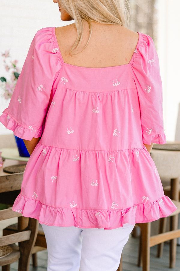 Plus Size pink babydoll top with white embroidered bows, square neckline, and ruffle trim.