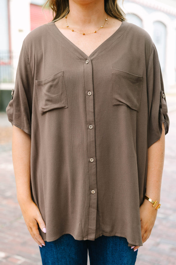 Plus Size brown short sleeve button-down blouse with a v-neckline and front chest pockets.
