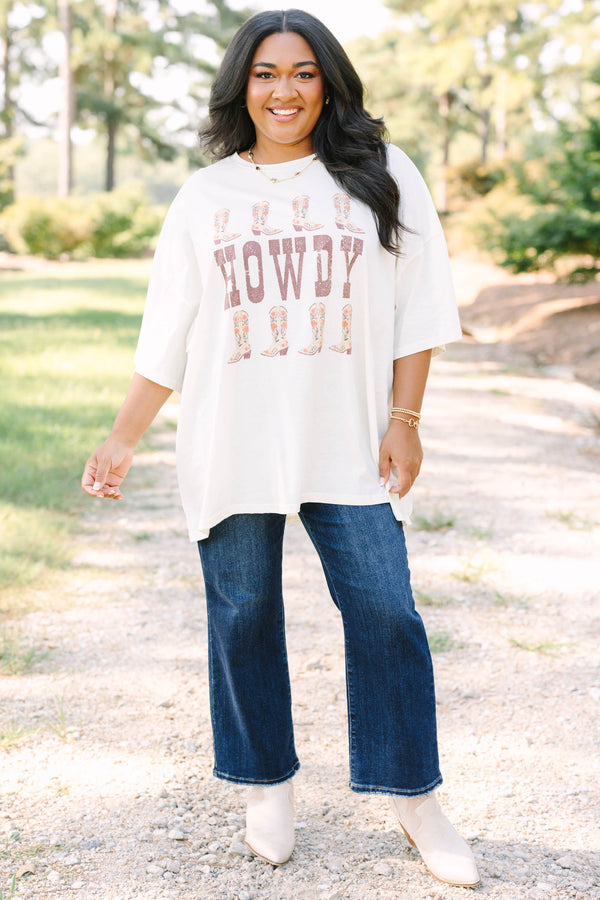 Plus size ivory boyfriend tee with 'HOWDY' and floral cowboy boots in a flowy 100% cotton fit.