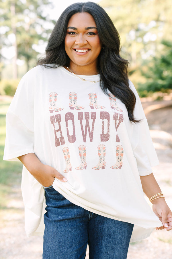 Plus size ivory boyfriend tee with 'HOWDY' and floral cowboy boots in a flowy 100% cotton fit.