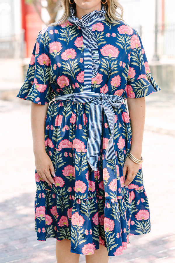 Plus Size navy floral dress with a striped ruffle neckline, button-front, and a striped waist sash.