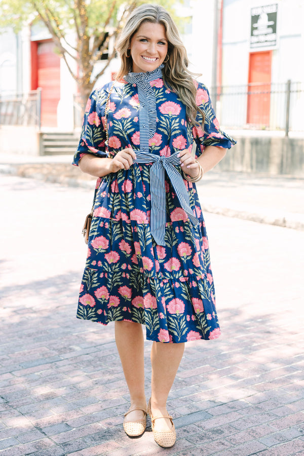 Plus Size navy floral dress with a striped ruffle neckline, button-front, and a striped waist sash.