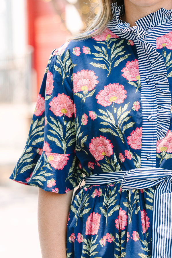 Plus Size navy floral dress with a striped ruffle neckline, button-front, and a striped waist sash.
