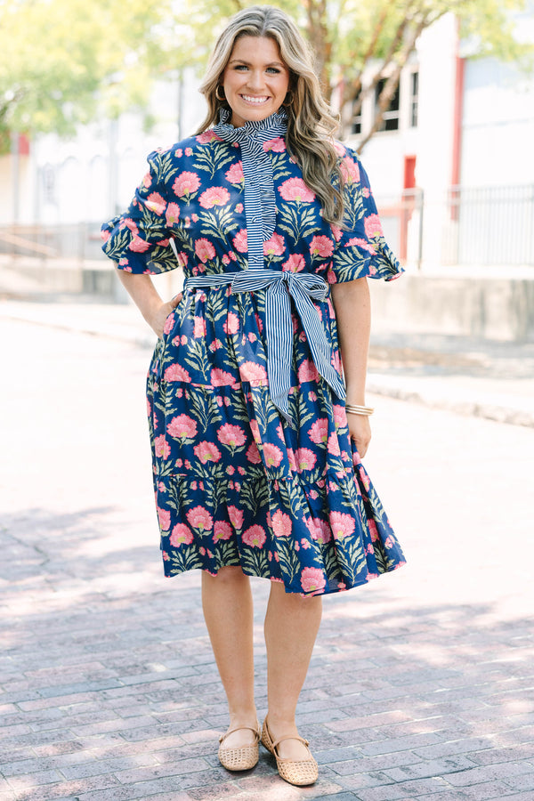 Plus Size navy floral dress with a striped ruffle neckline, button-front, and a striped waist sash.