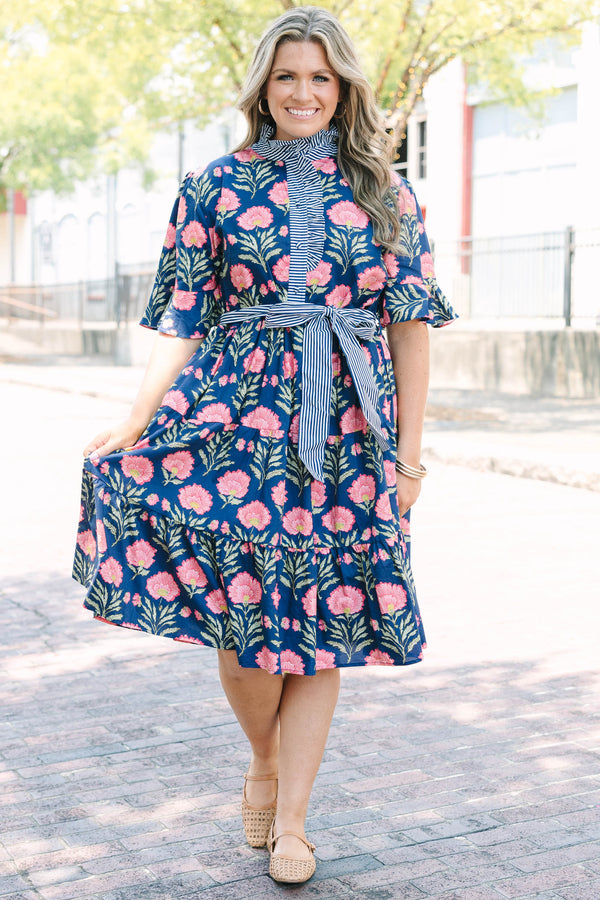Plus Size navy floral dress with a striped ruffle neckline, button-front, and a striped waist sash.