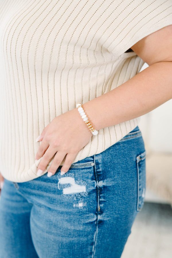 Halo Glow Bracelet featuring polished gold-toned  and crisp white beads.