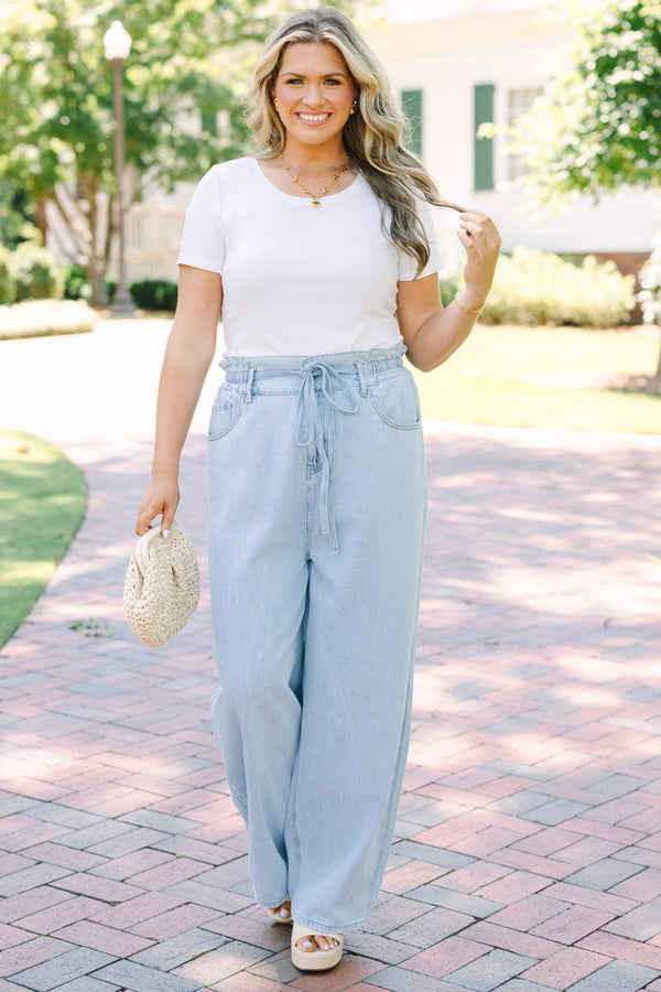 Plus Size light wash wide-leg jeans with an elastic drawstring waist and front pockets.