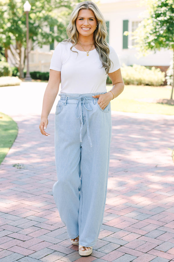 Plus Size light wash wide-leg jeans with an elastic drawstring waist and front pockets.