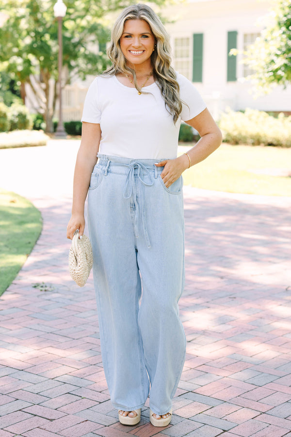 Plus Size light wash wide-leg jeans with an elastic drawstring waist and front pockets.