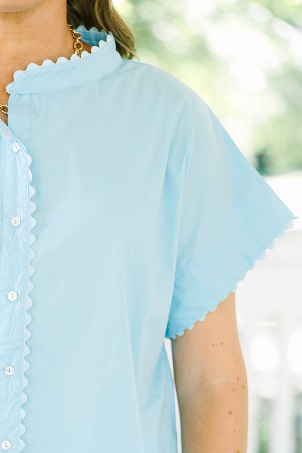 Plus size light blue button-front cotton blouse with scalloped trim on the neckline and sleeves.