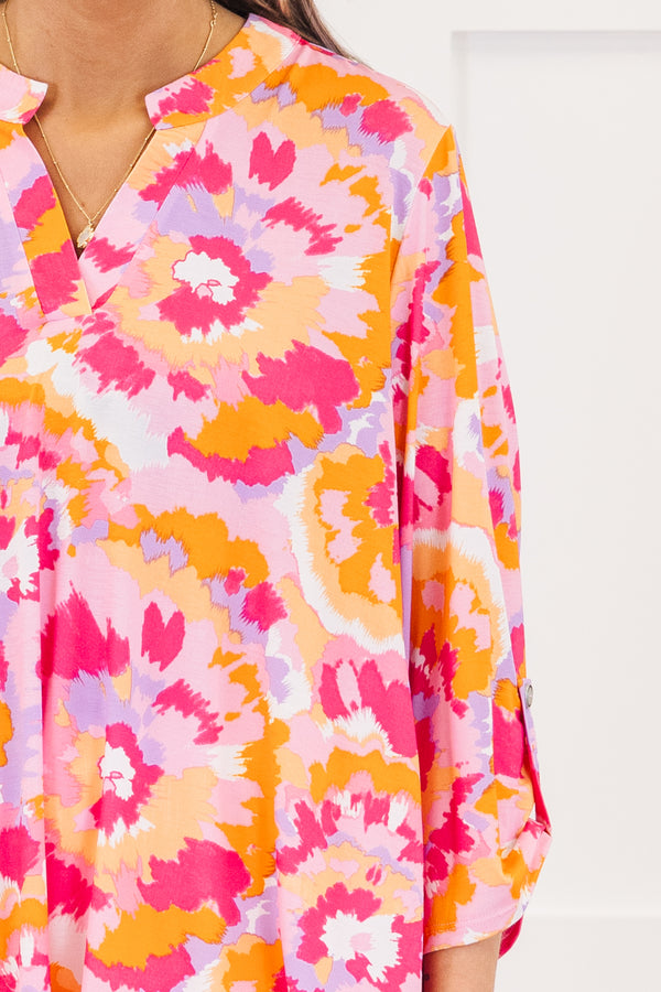 Chic Soul plus size clothing, pink three quarter length sleeve top with v neckline and button detail on sleeve with abstract orange/pink/purple print