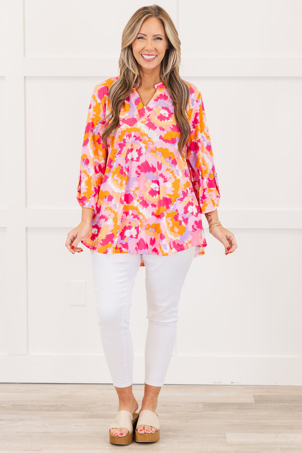 Chic Soul plus size clothing, pink three quarter length sleeve top with v neckline and button detail on sleeve with abstract orange/pink/purple print