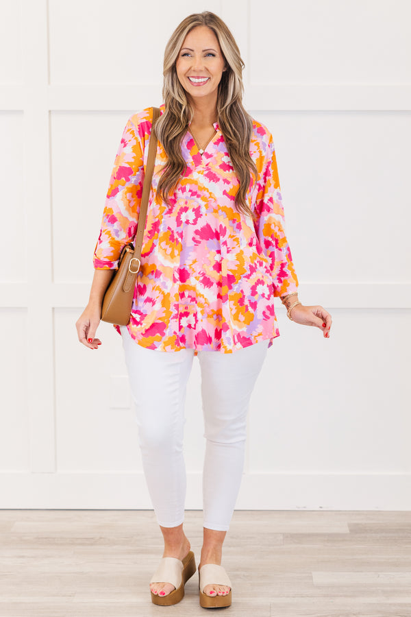 Chic Soul plus size clothing, pink three quarter length sleeve top with v neckline and button detail on sleeve with abstract orange/pink/purple print