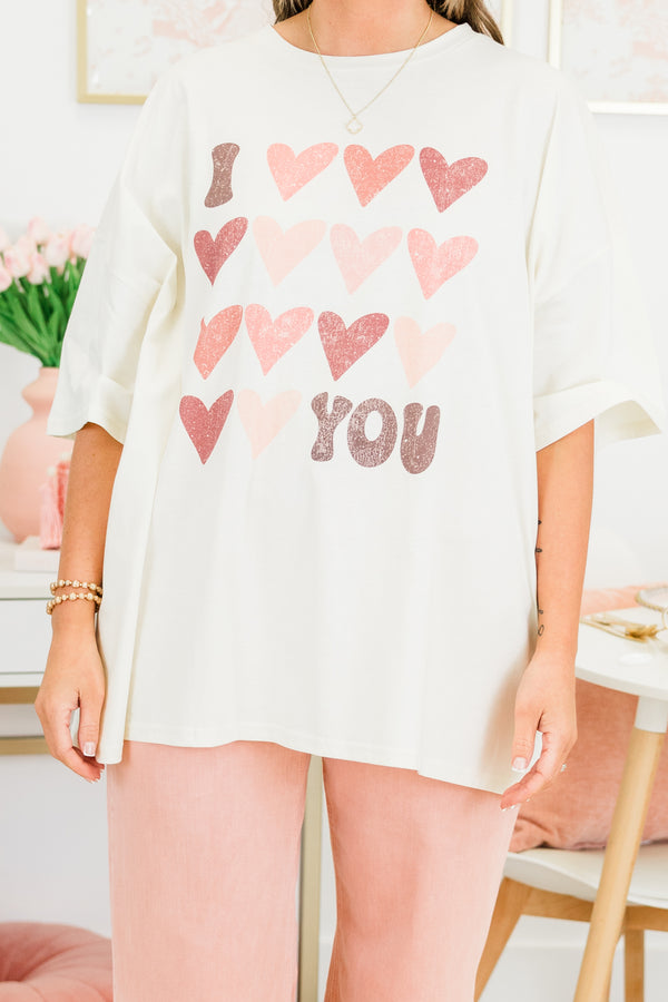 Chic Soul plus size clothing, short-sleeve ivory boyfriend tee with scoop-neckline and graphic art of several pink multi-colored hearts with graphic lettering stating 