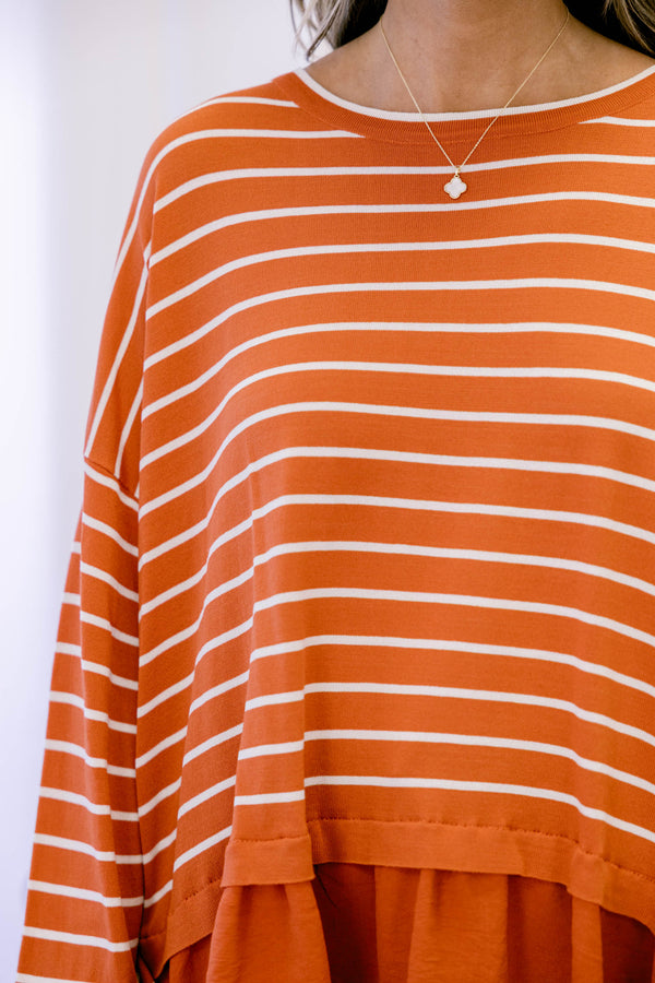 Chic Soul plus size clothing, rust red long sleeve top with white thin horizontal stripes and a ruffle hem