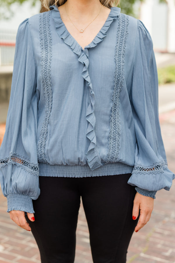 Chic Soul plus size clothing, denim blue long sleeve flowy top with v neckline and cuff sleeves with ruffle detail along neckline and front with eyelet details on front and sleeves