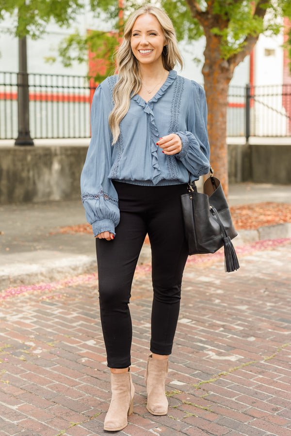 Chic Soul plus size clothing, denim blue long sleeve flowy top with v neckline and cuff sleeves with ruffle detail along neckline and front with eyelet details on front and sleeves