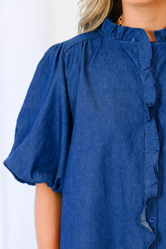 Plus size dark denim top with ruffled collar, button-down front, and elastic bubble sleeves.