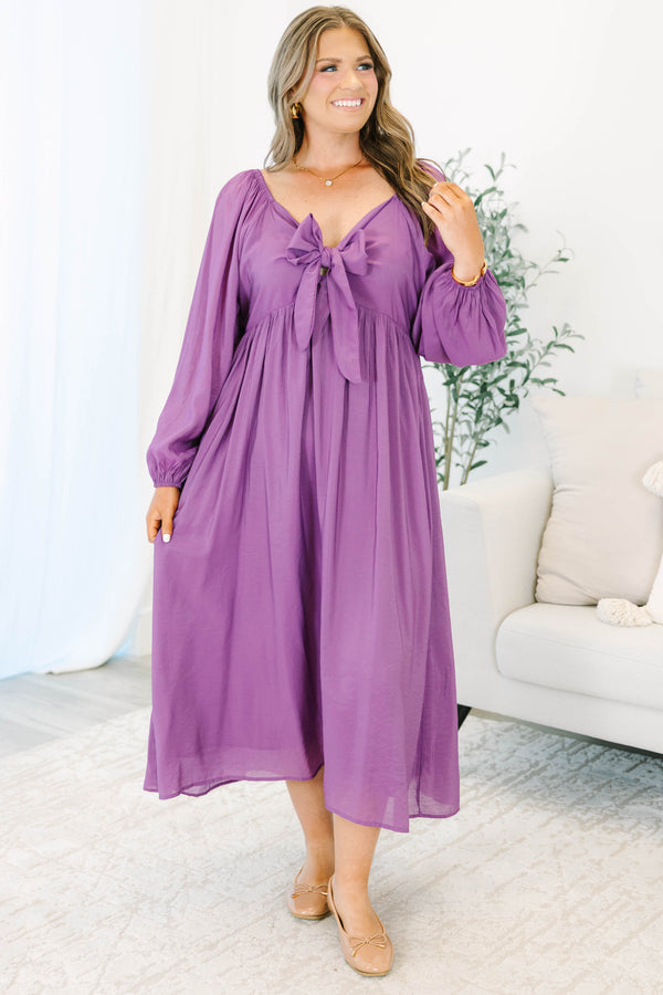 Plus Size plum midi dress with a bow-tie neckline, long balloon sleeves, and a flowy skirt.