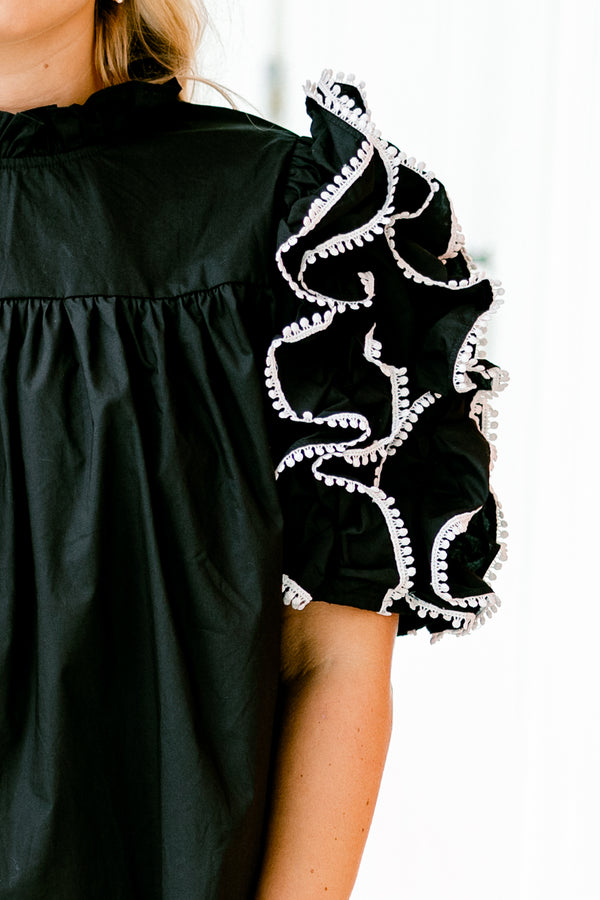 Chic Soul plus size clothing, Black top with short sleeves that have ruffle details on each sleeve that are stitched with a white textured pattern
