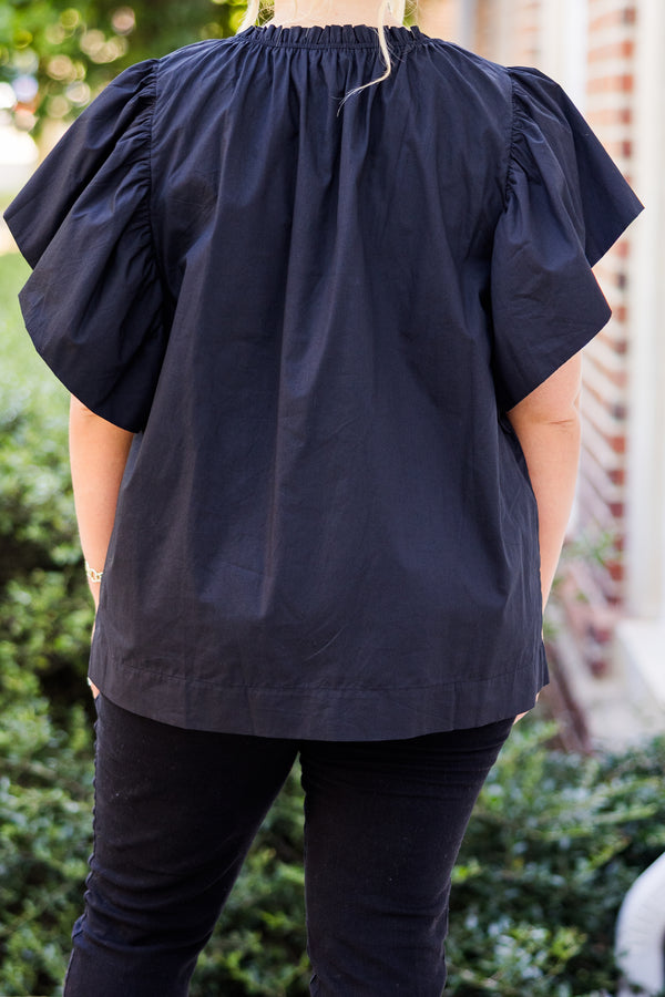  Chic Soul plus size clothing, short-flutter-sleeve black top with smocked neckline and brown sequin football patches scattered across top 