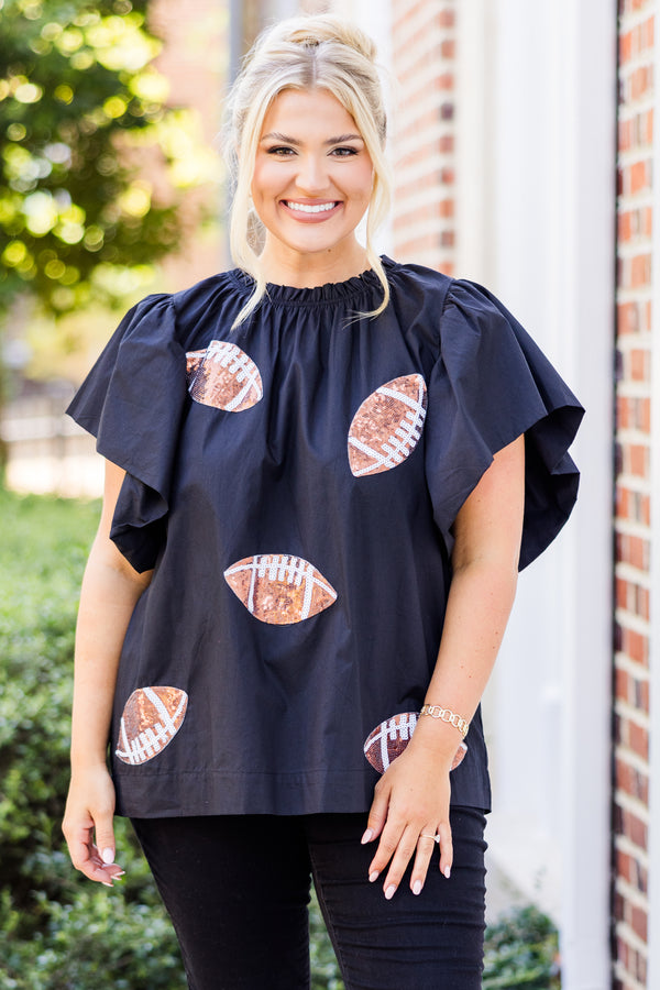  Chic Soul plus size clothing, short-flutter-sleeve black top with smocked neckline and brown sequin football patches scattered across top 