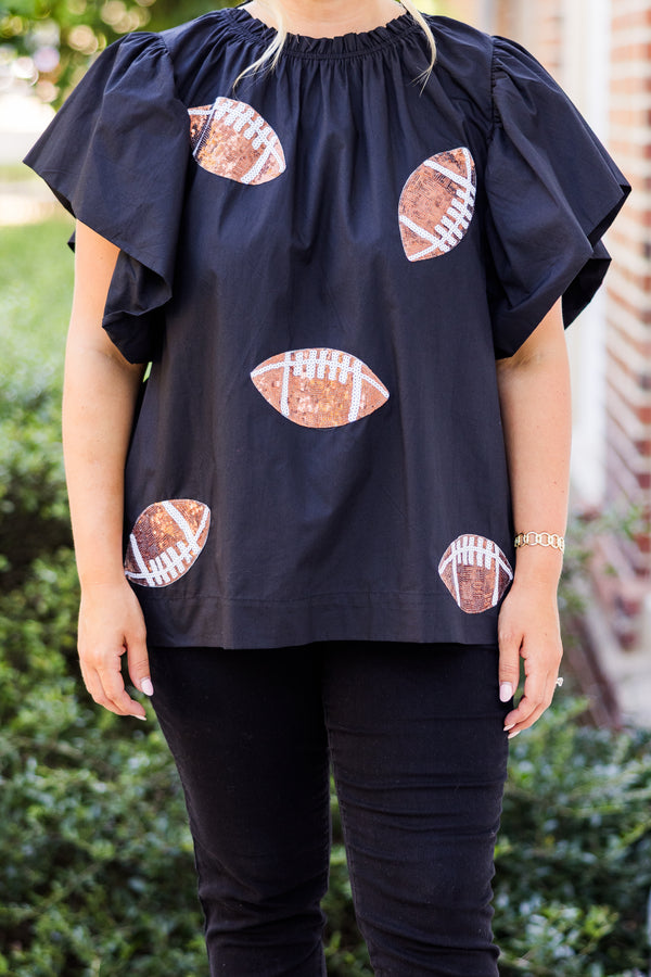  Chic Soul plus size clothing, short-flutter-sleeve black top with smocked neckline and brown sequin football patches scattered across top 