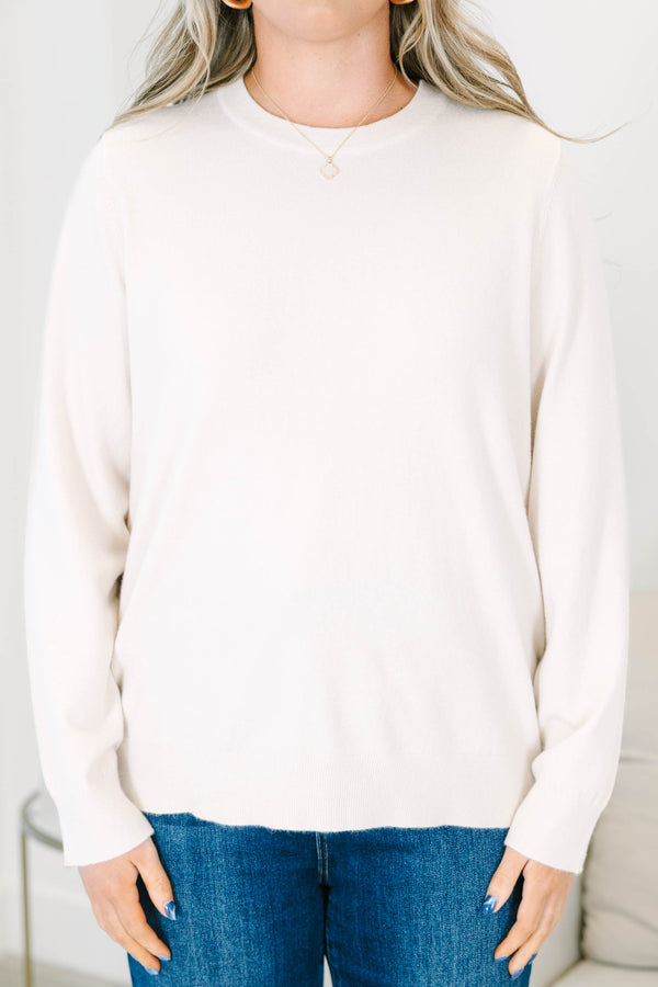 Plus size oatmeal crewneck sweater with a relaxed fit and soft, stretchy knit fabric.