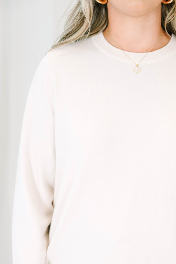 Plus size oatmeal crewneck sweater with a relaxed fit and soft, stretchy knit fabric.