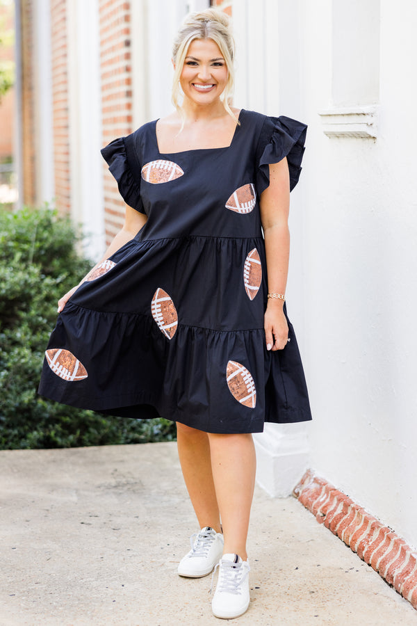 Chic Soul plus size clothing, short-flutter-sleeve black ruffled baby doll dress with brown sequined football patches scattered across dress with square neck-line