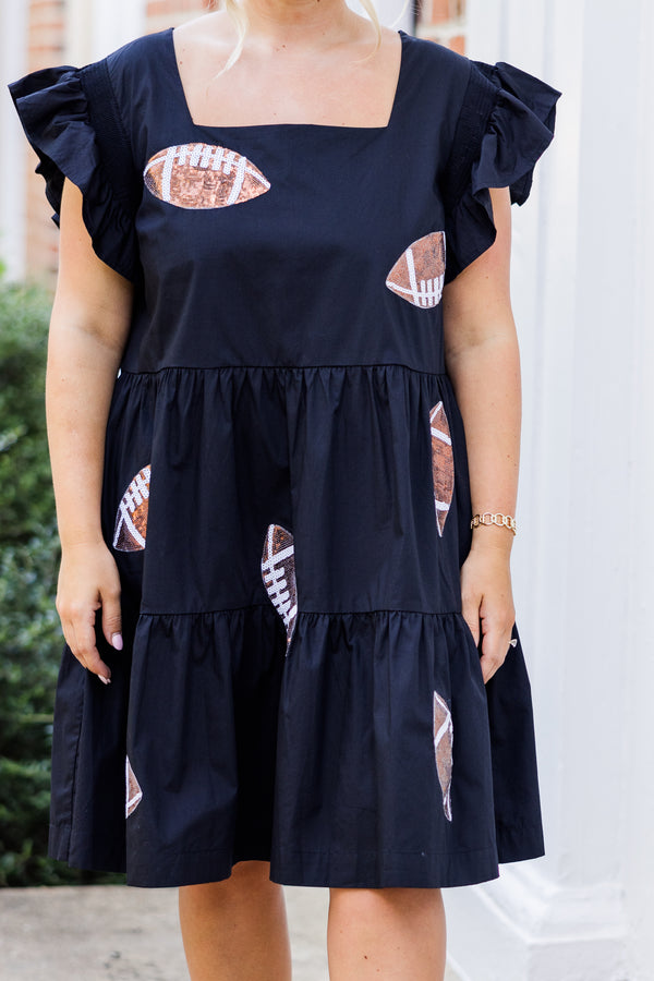 Chic Soul plus size clothing, short-flutter-sleeve black ruffled baby doll dress with brown sequined football patches scattered across dress with square neck-line
