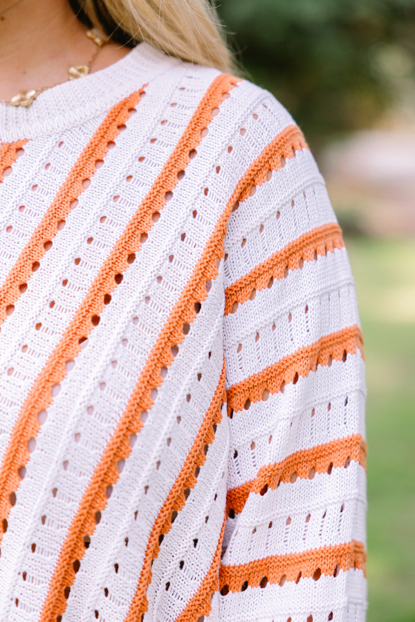 Chic Soul plus size clothing, white knit long sleeve sweater with coral stripes in a v pattern on the body and horizontal stripes on the sleeves
