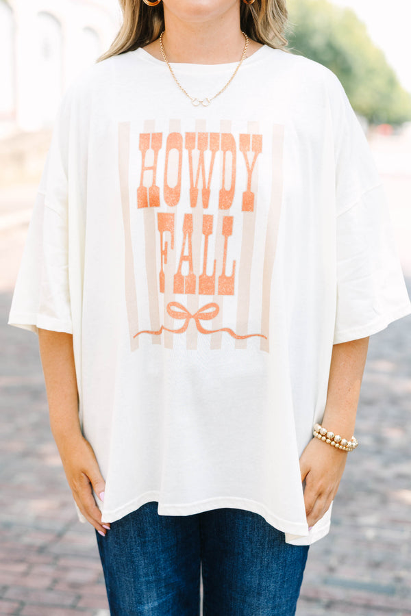 Plus Size ivory boyfriend tee with orange Howdy Fall graphic and blue denim jeans.