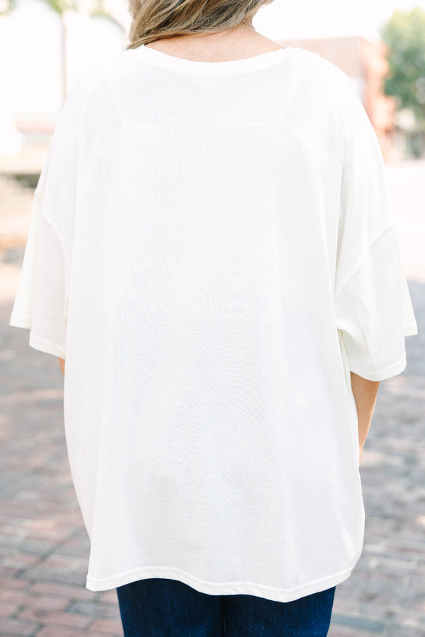 Plus Size ivory boyfriend tee with orange Howdy Fall graphic and blue denim jeans.