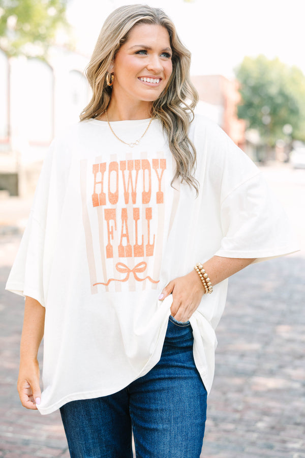 Plus Size ivory boyfriend tee with orange Howdy Fall graphic and blue denim jeans.