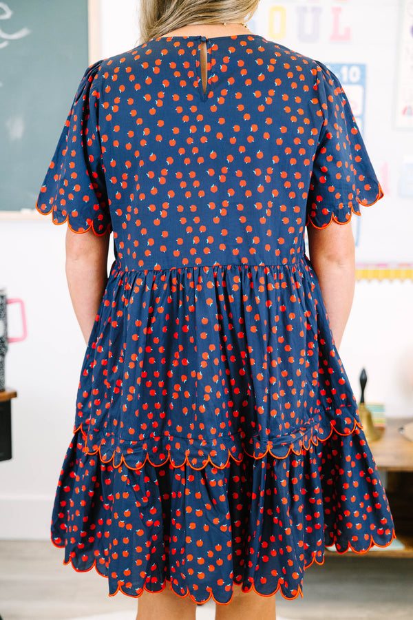 Plus Size navy dress with red apple print, tiered skirt, and scalloped red piping on sleeves.