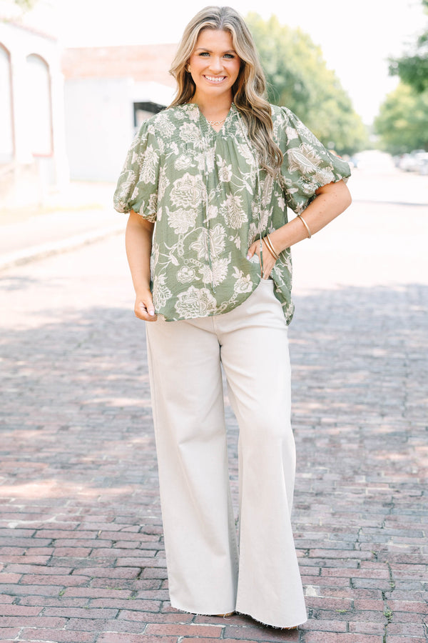 Plus Size almond-colored wide-leg jeans with a high-waist fit and raw-edge hem.