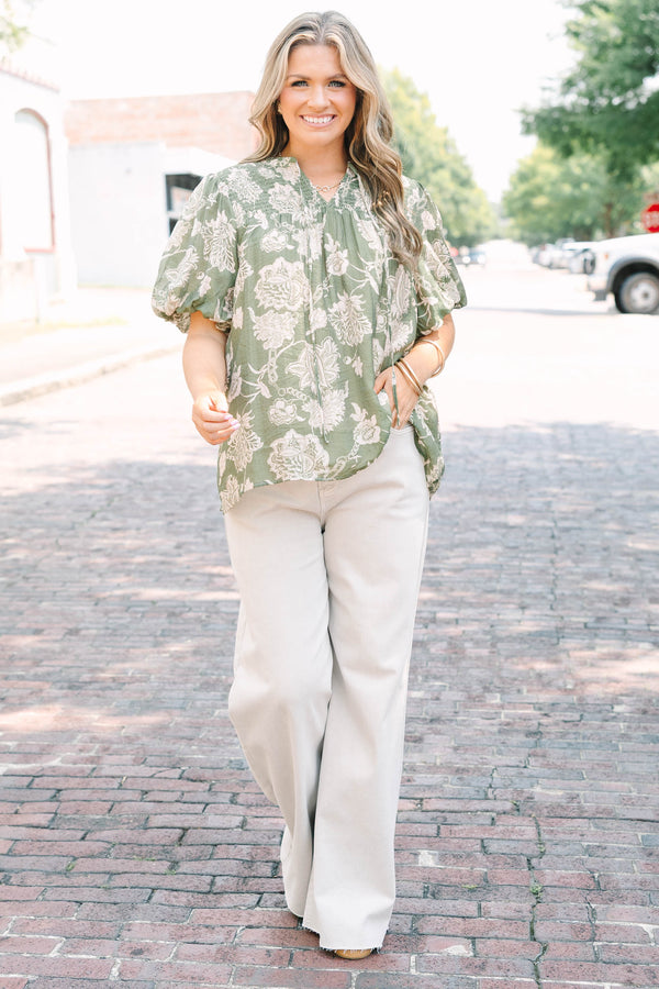 Plus Size almond-colored wide-leg jeans with a high-waist fit and raw-edge hem.