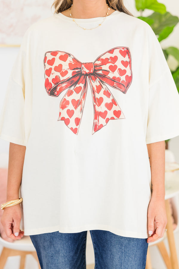 Chic Soul plus size clothing, short-sleeve ivory white boyfriend tee with a scoop-neckline and graphic art of a bow with a red heart pattern