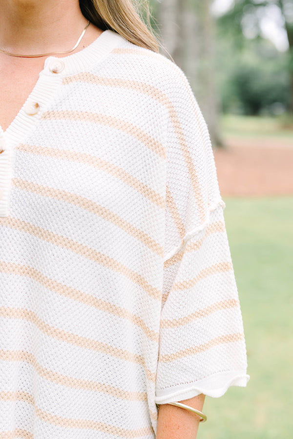 Plus Size natural and white striped knit top with a buttoned henley neckline and 3/4 sleeves.