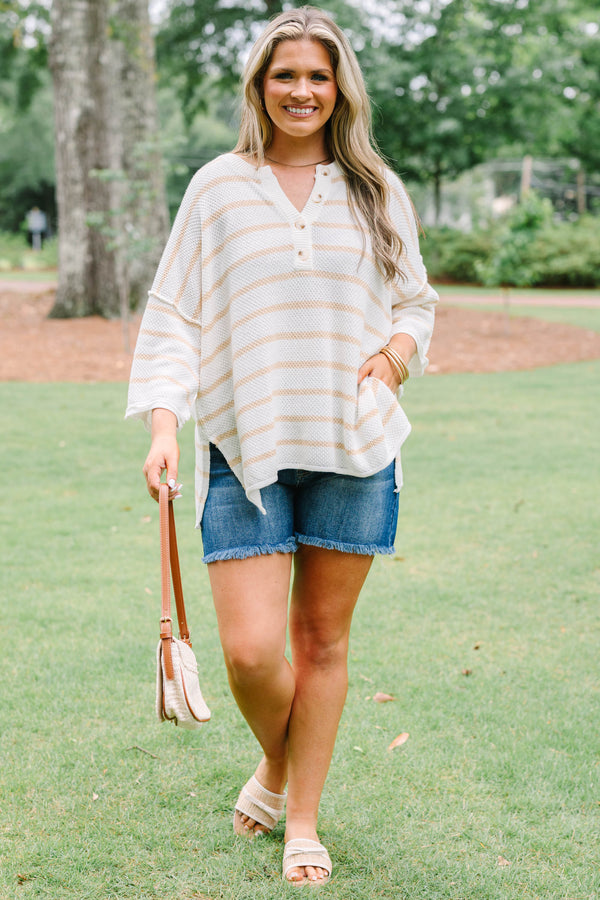 Plus Size natural and white striped knit top with a buttoned henley neckline and 3/4 sleeves.