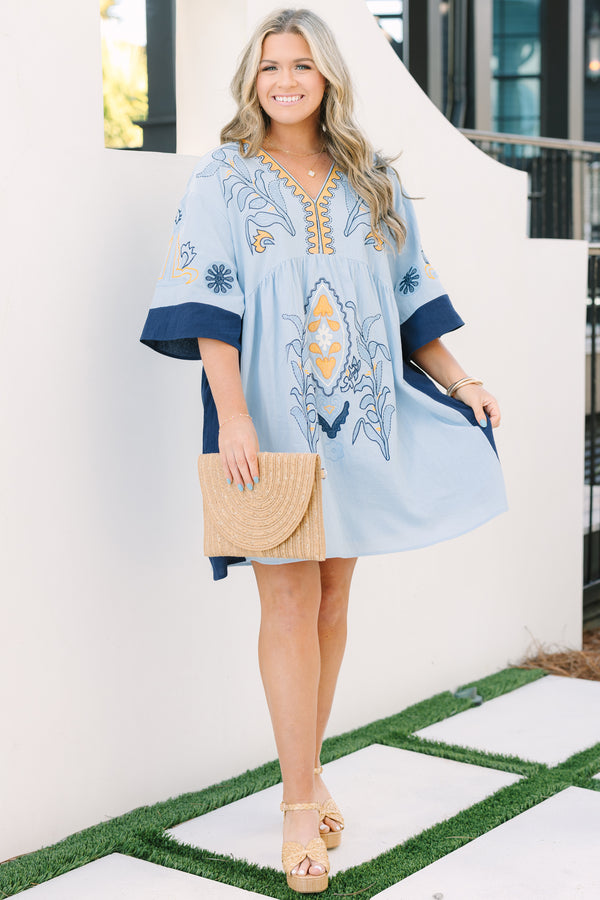 Chic Soul plus size clothing, light blue v neck tunic dress with orange and navy embroidery detailing and navy blocking on the edge of the sleeve and sides of the dress