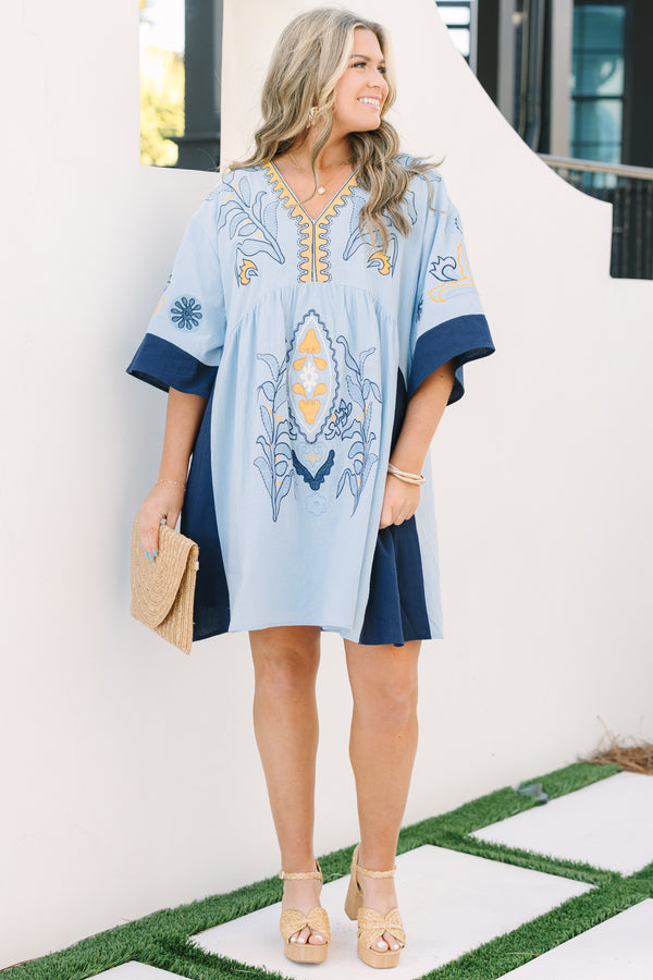 Chic Soul plus size clothing, light blue v neck tunic dress with orange and navy embroidery detailing and navy blocking on the edge of the sleeve and sides of the dress