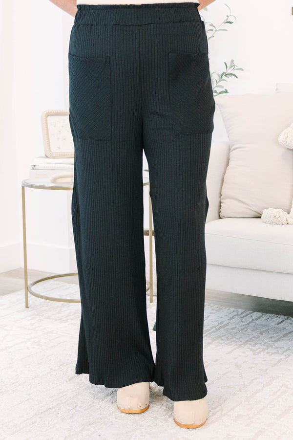 Plus Size black wide-leg ribbed knit pants with an elastic waistband and front patch pockets.