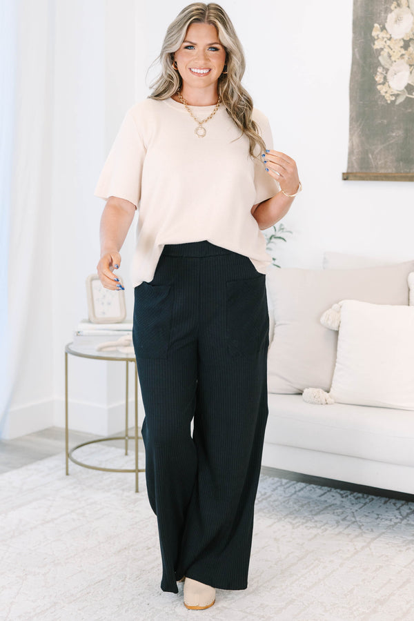 Plus Size black wide-leg ribbed knit pants with an elastic waistband and front patch pockets.